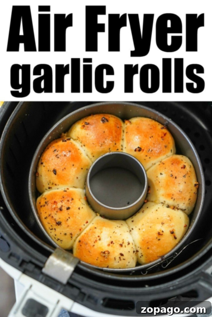 Crispy Air Fryer Frozen Rolls 11 Air fryer garlic bread served with a side of dipping sauce, garnished with fresh parsley.