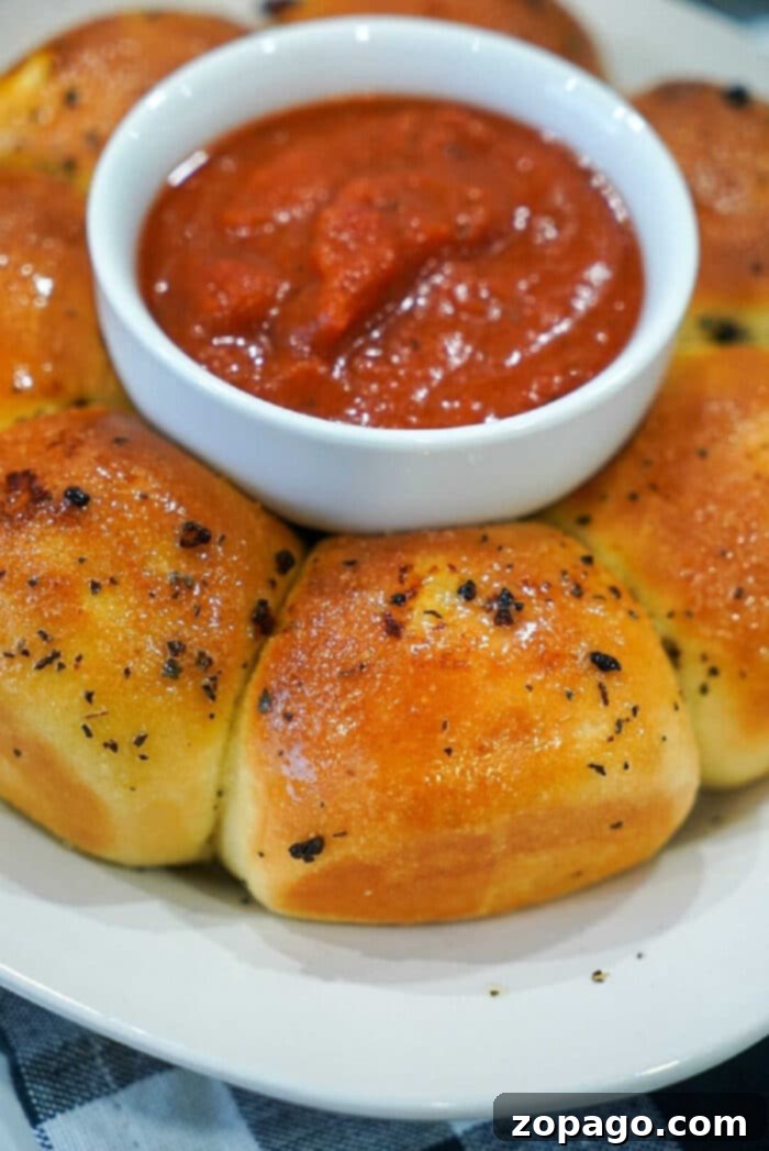 Crispy Air Fryer Frozen Rolls 7 Delicious air fryer garlic rolls, glistening with butter, ready for dipping.