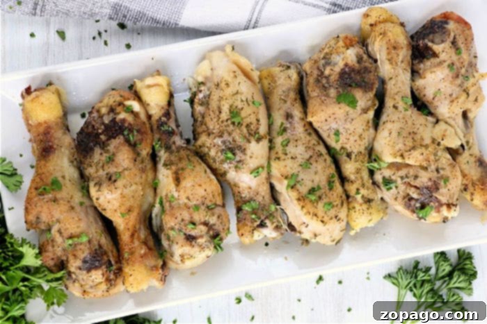 Fall-Off-The-Bone Slow Cooker Chicken Legs 8 Delicious chicken drumsticks arranged on a platter, cooked to perfection.
