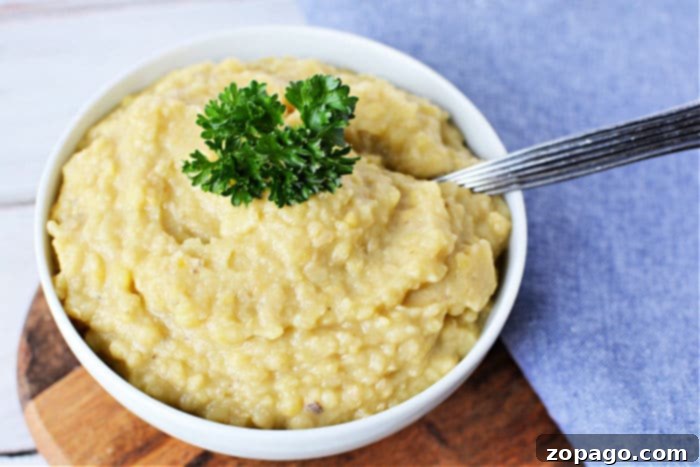 Easy Instant Pot Red Lentils 8 A rustic wooden spoon scoops a serving of healthy, cooked lentils from a larger bowl, ready for a nutritious meal.