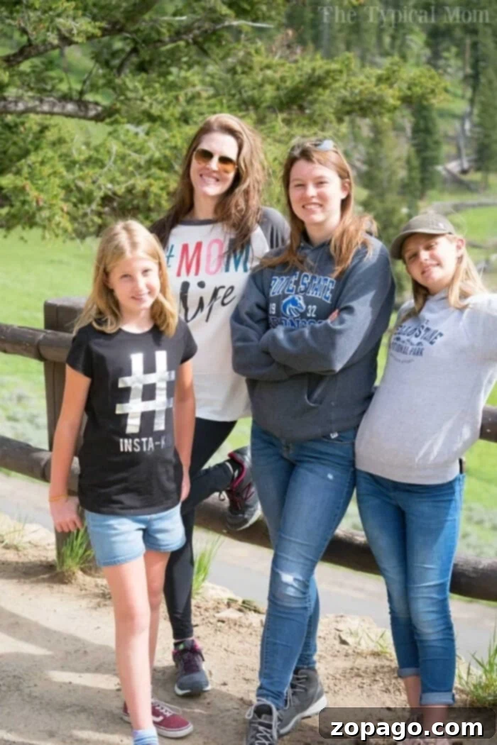 Begin Your Homeschooling Journey 2 Four people posing casually outdoors by a wooden fence with lush greenery in the background, perhaps discussing how to start homeschooling.