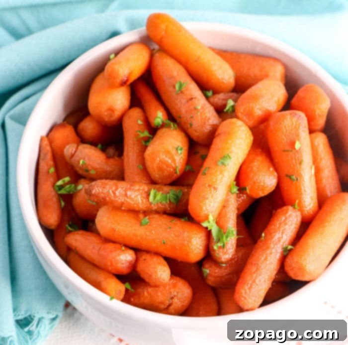 Glazed Slow Cooker Carrots 8 A close-up of the delicious crockpot carrots recipe, showcasing the tender texture and sweet, buttery glaze.
