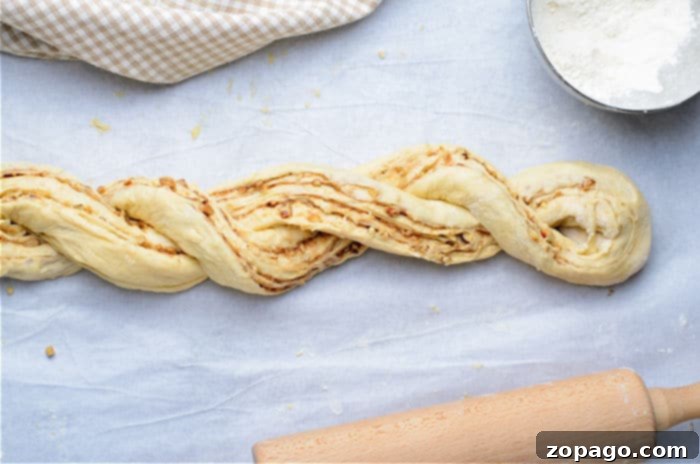 The Art of Braided Bread 8 Homemade wreath bread rising on a baking sheet.