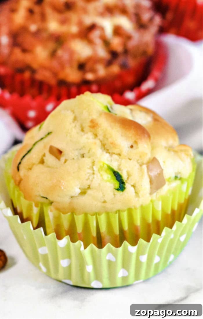 Orchard and Garden Muffins 8 A batch of freshly baked zucchini muffins cooling on a wire rack.