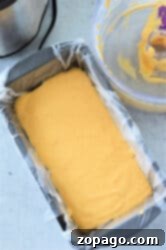 Make the Best Velveeta Cheese Sauce 7 Loaf pan lined with wax paper, ready for the cheese mixture to be poured, demonstrating the setup for making a solid Velveeta block.