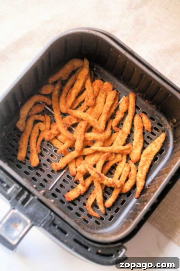 Crispy Air Fryer Chicken Fries 2 Crispy homemade chicken fries perfectly golden in an air fryer basket.