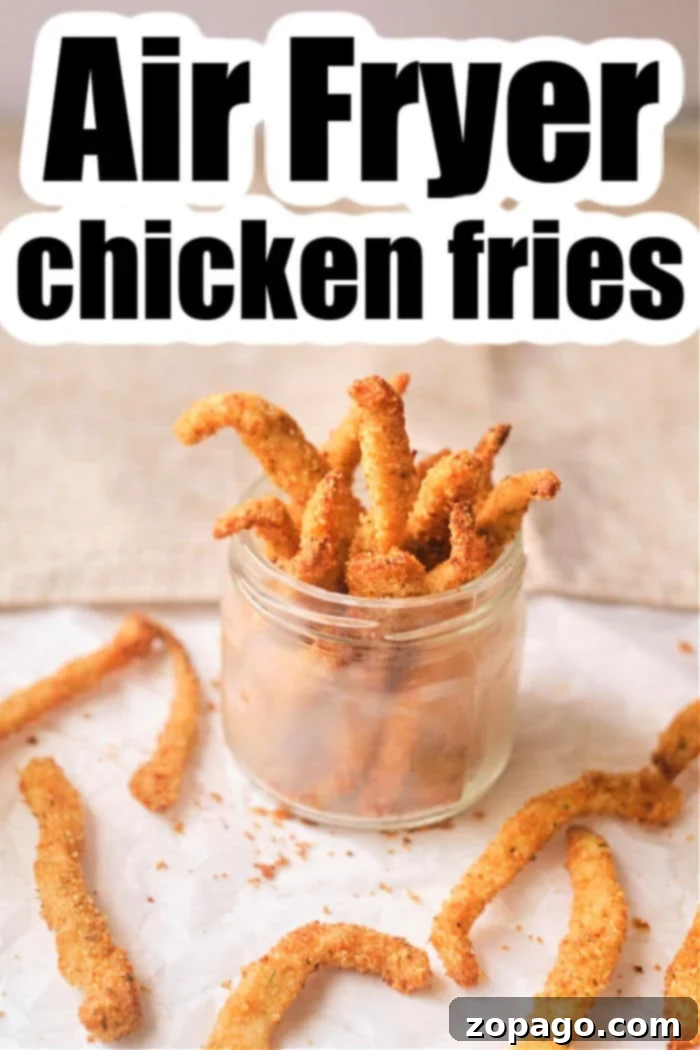 Crispy Air Fryer Chicken Fries 5 A close-up of perfectly cooked Air Fryer Chicken Fries on a plate, garnished with fresh herbs.