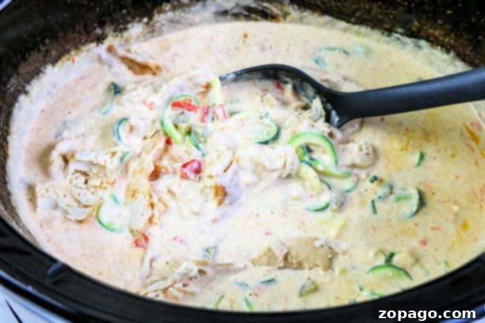 Creamy Slow Cooker Chicken Alfredo 5 Creamy Crockpot Chicken Alfredo with pasta and fresh herbs.