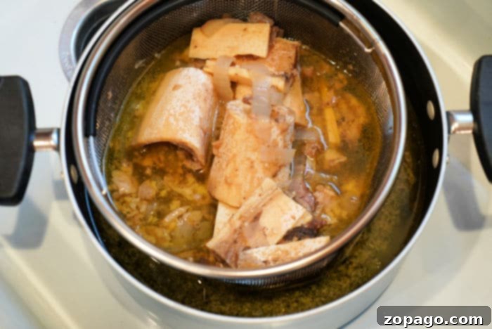 Effortless Instant Pot Bone Broth 5 Cooked bone marrow resting on a plate, ready to be used or discarded