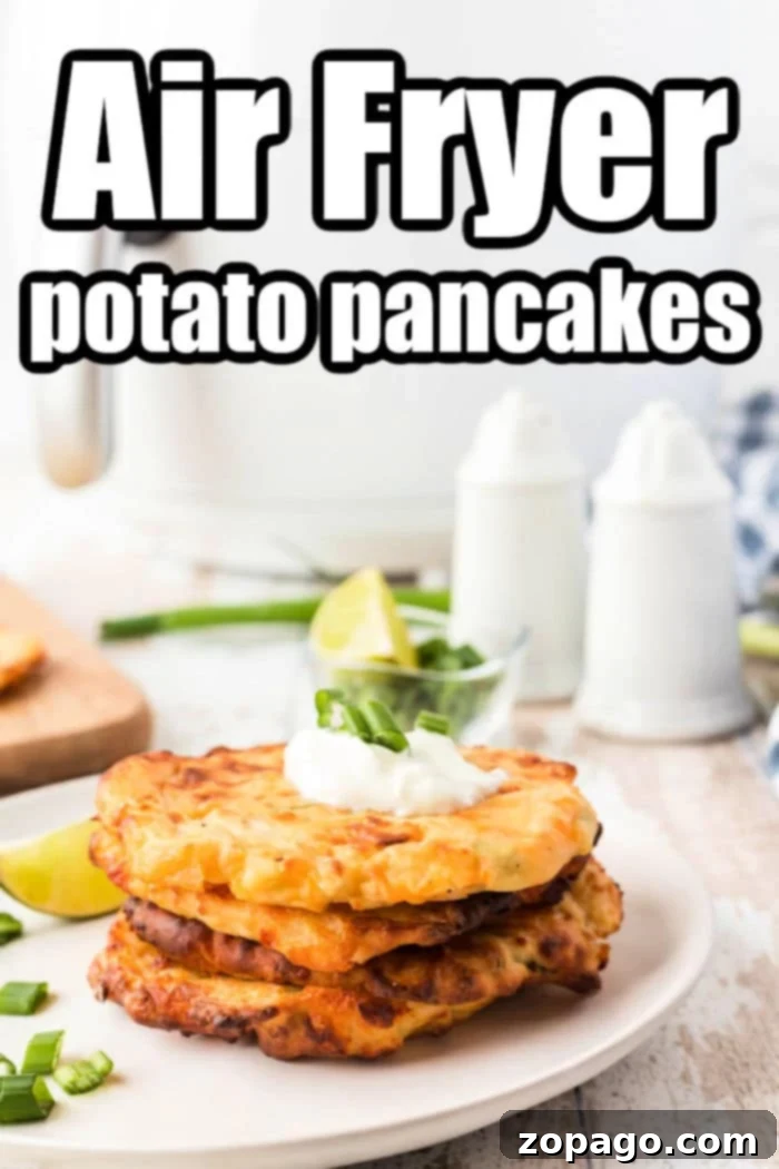 Crispy Air Fryer Potato Pancakes 7 A plate of freshly made Air Fryer Potato Pancakes, golden and ready to serve.