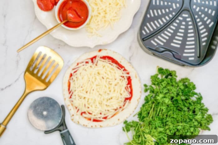 Effortless Air Fryer Tortilla Pizzas 4 Close-up of three low carb tortilla pizzas, garnished with fresh basil, showcasing golden-brown crusts and bubbling cheese.