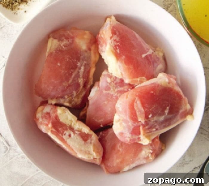 Frozen chicken thighs ready for slow cooking.
