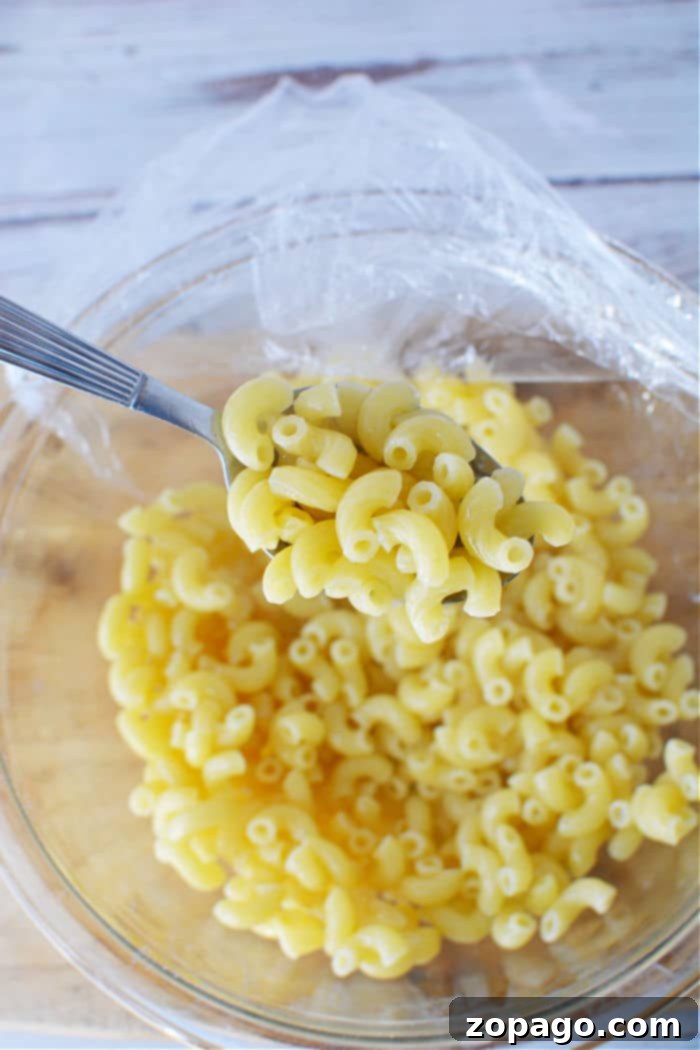 Mac 'n' Cheese in Minutes 3 How to Cook Pasta in the Microwave - Close-up of uncooked elbow macaroni, ready for microwave cooking.