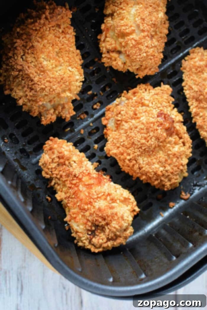 Crispy Gluten-Free Air Fryer Chicken Wings 2 Crispy gluten free chicken wings cooked in an air fryer, golden brown and ready to serve.