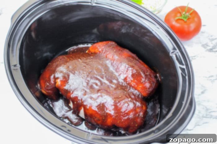 Effortless Crockpot Frozen Chicken Breasts 4 Slow cooked frozen chicken breast, perfectly tender and ready for shredding.