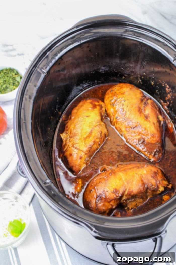 No Thaw Slow Cooker Chicken Breasts 8 Slow Cooker Chicken Caprese, beautifully presented with melted cheese and fresh herbs.