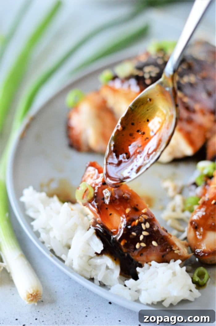 Easy Teriyaki Chicken with Bottled Sauce 7 Beautifully baked teriyaki chicken breast, glistening with sauce and ready to be served, a testament to the ease of this bottled teriyaki sauce recipe.