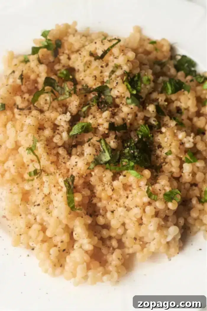 Mastering Pearl Couscous 6 Close up of instant pot pearl couscous, showing its fluffy and round texture.