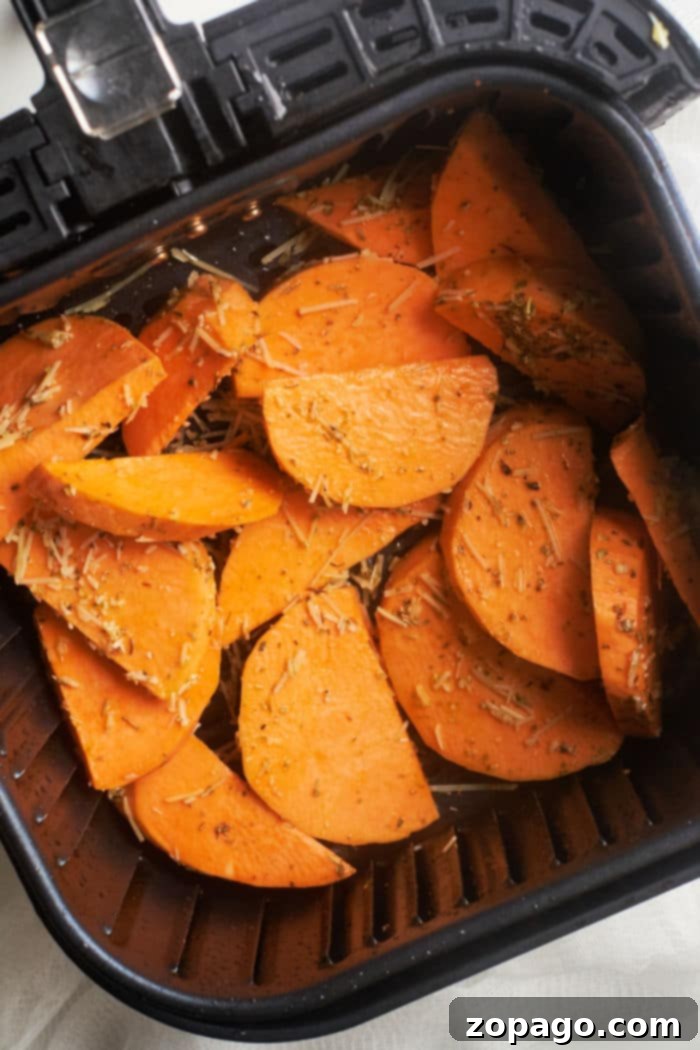 Ultimate Crispy Air Fryer Sweet Potato Wedges 5 Air Fryer Sweet Potato Steak Fries in a bowl, garnished with fresh herbs.
