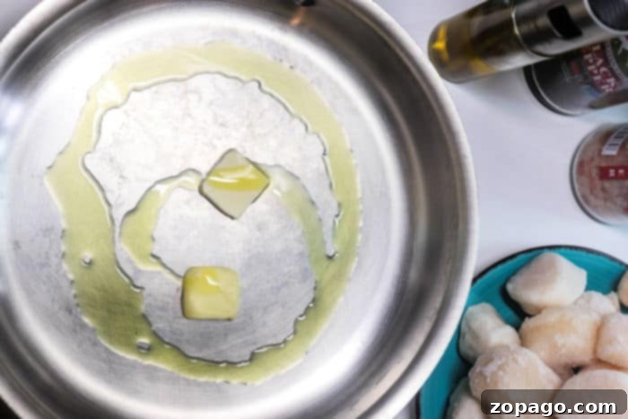Cooking Frozen Scallops Like a Pro 4 Frozen scallops sizzling in a pan, achieving a perfect sear.