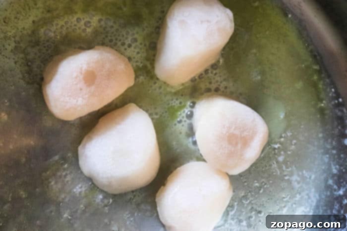 Cooking Frozen Scallops Like a Pro 5 Guide on how long to cook frozen scallops for optimal texture.