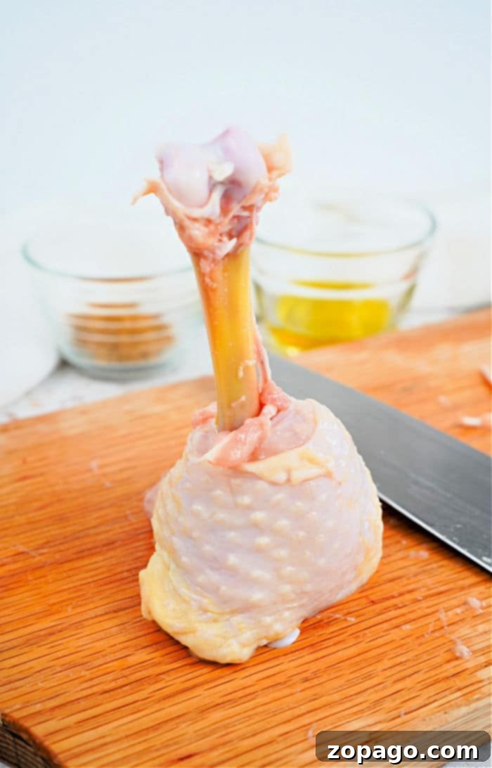 Delicious Lollipop Chicken Drumsticks Recipe 3 Close-up of golden-brown lollipop chicken drumsticks, perfectly seasoned and cooked.