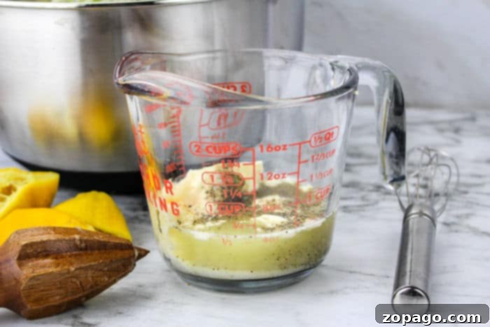 Bold Blue Cheese Slaw 4 Coleslaw dressing ingredients: mayonnaise, lemons, whisk, and measuring cup