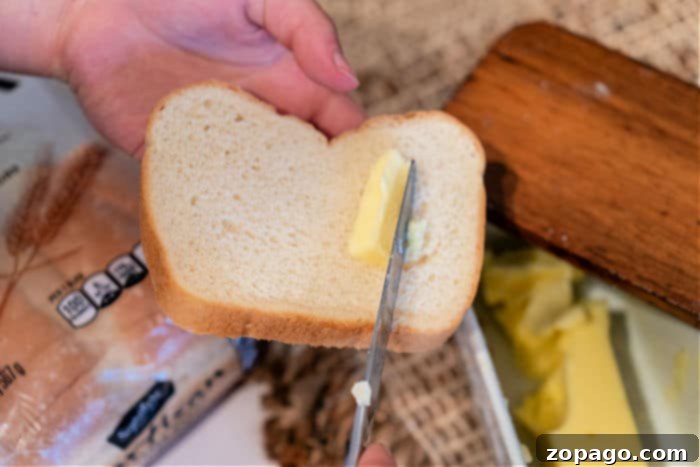 Perfect Air Fryer Toast 4 Close-up of buttered bread slices arranged in an air fryer basket before toasting