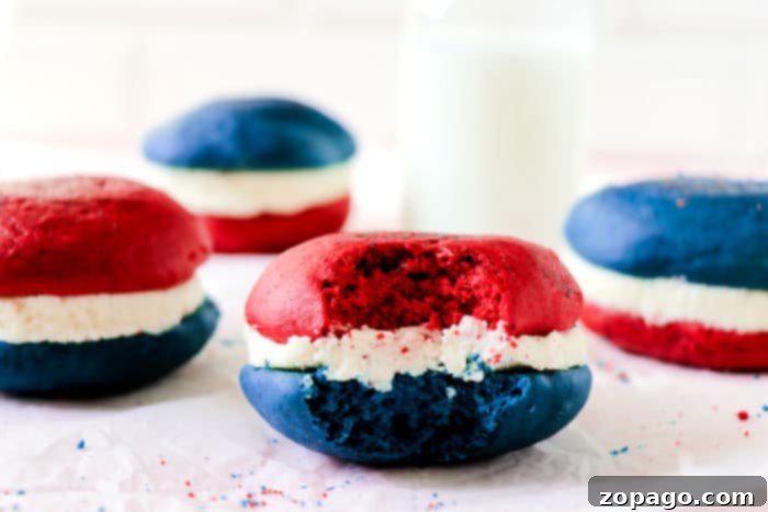 Easy Cake Mix Whoopie Pies 8 A festive array of red, white, and blue whoopie pies, likely for Fourth of July, arranged appealingly on a platter. The image highlights their vibrant colors and appealing presentation.