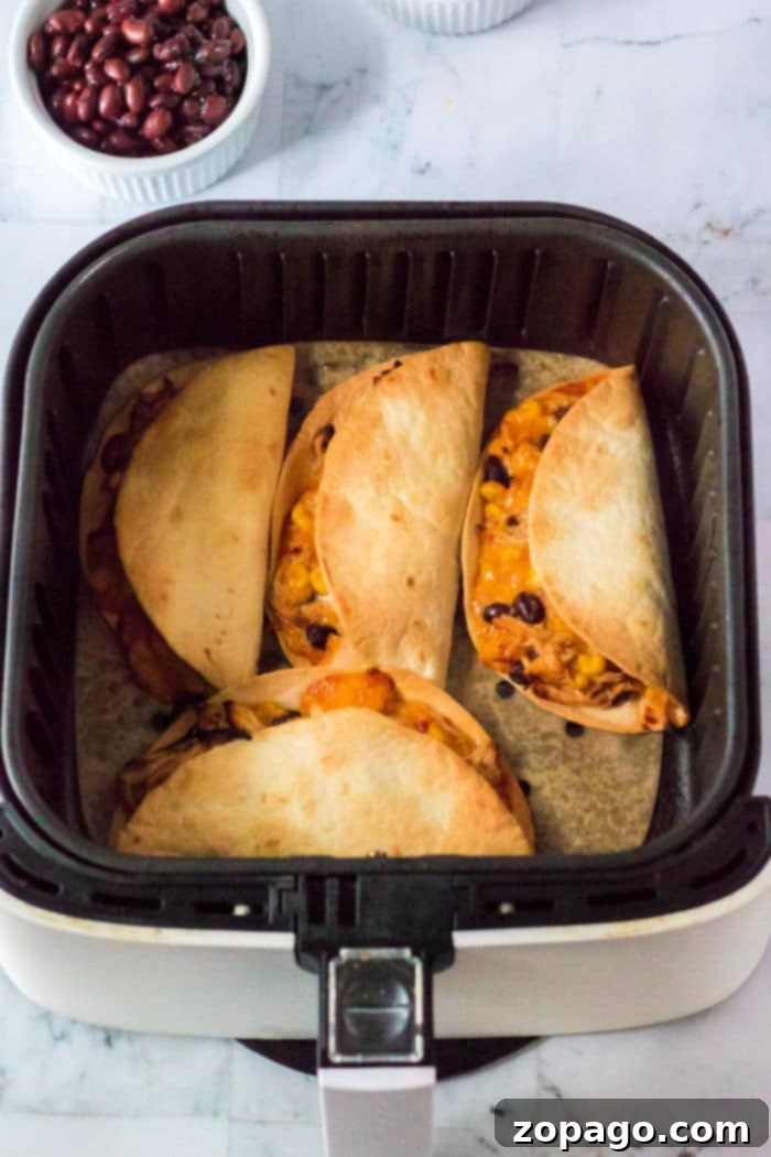 Crispy Air Fryer Tacos 7 Air Fryer chicken Tacos, showing a plate of freshly made tacos with vibrant toppings.