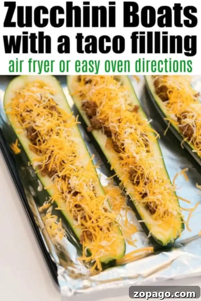 Leftover Taco Meat Magic 3 Close-up of zucchini boats filled with leftover taco meat and topped with shredded cheese on a foil-lined baking sheet. The text reads: Zucchini Boats with a taco filling - air fryer or easy oven directions.