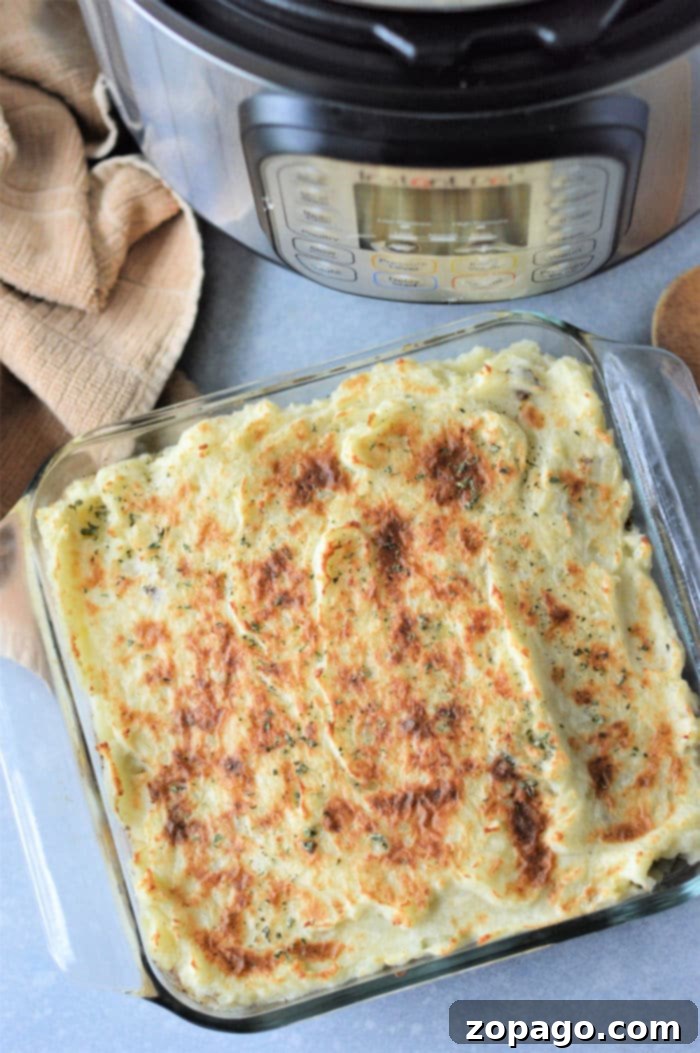 One-Pot Wonder: Instant Pot Shepherd's Pie 2 Delicious Instant Pot Shepherd's Pie ready to serve, showing the golden mashed potato topping and rich meat filling.