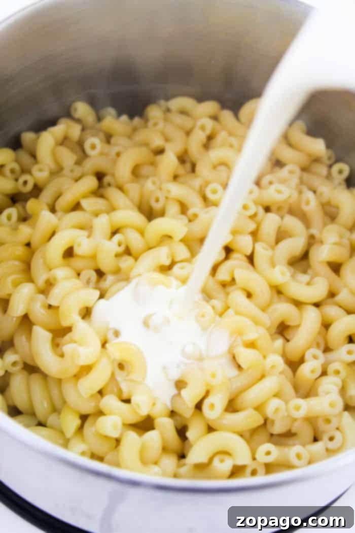 One-Pan Pepperoni Pizza Mac 3 Close-up of creamy mac and cheese in a bowl, ready for toppings
