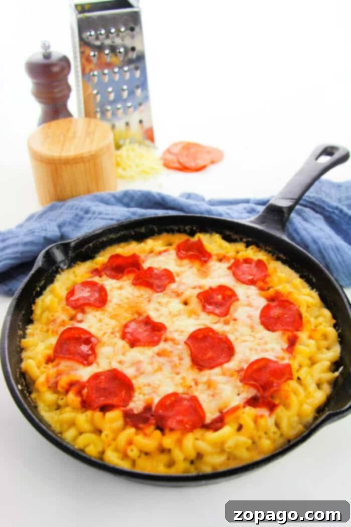 One-Pan Pepperoni Pizza Mac 6 A large serving of Pizza Macaroni and Cheese in a cast iron skillet