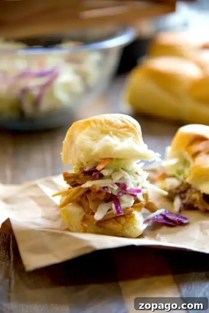 Pulled Pork Sliders 2 Irresistible Pulled Pork Sliders with BBQ sauce on Hawaiian rolls