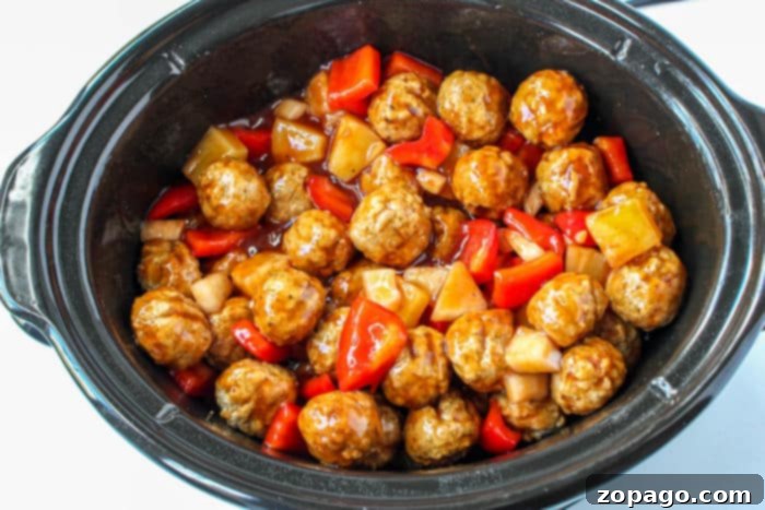 Effortless BBQ Meatballs 4 Crockpot Meatballs with a rich sauce and pineapple chunks.