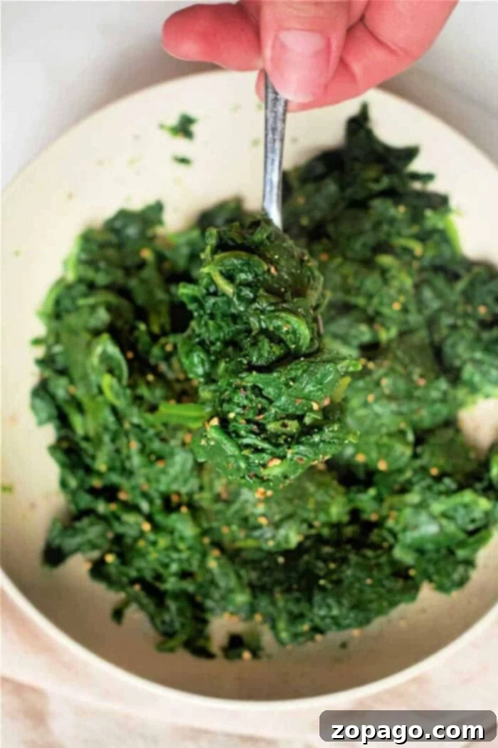 Make Frozen Spinach Taste Amazing 8 A vibrant bowl of cooked frozen spinach, perfectly seasoned and ready to enjoy as a versatile ingredient.