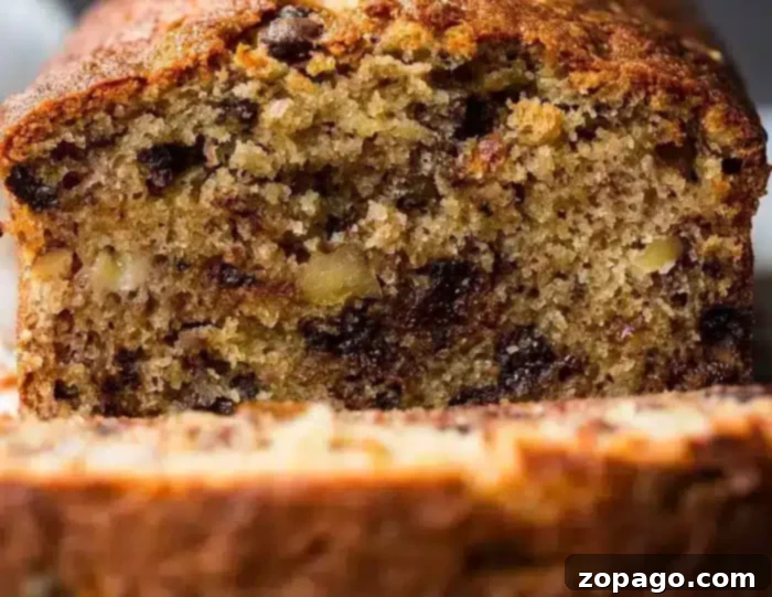 A slice of moist banana bundt cake with chocolate chips, perfect for a sweet treat.