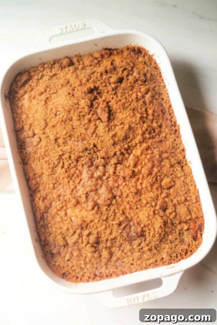 A warm, inviting slice of coffee cake with bananas, perfectly baked and ready to eat.