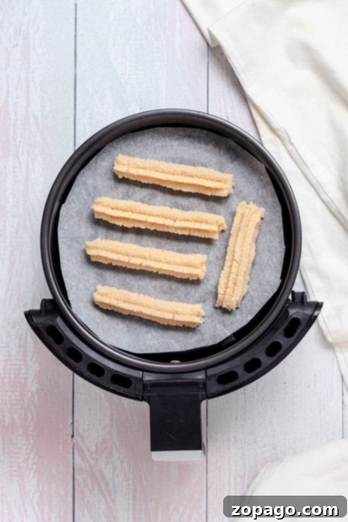 Air Fryer Lava Chocolate Churros 5 Air Fryer Filled Churros, perfectly golden brown and coated in cinnamon sugar, showcasing their irresistible texture.
