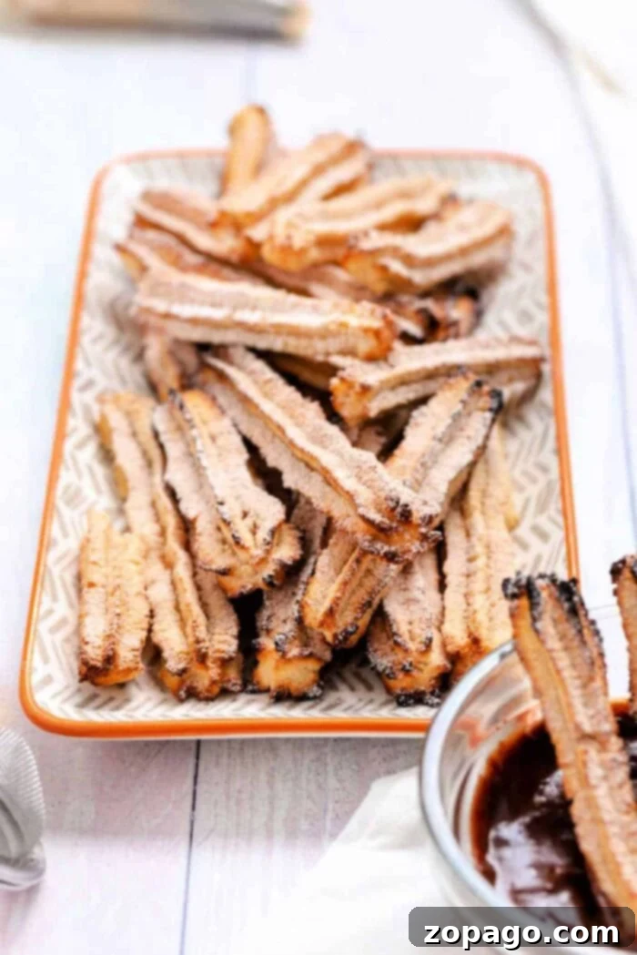 Air Fryer Lava Chocolate Churros 7 Air Fryer Chocolate Filled Churros, beautifully golden and dusted with cinnamon sugar, with a hint of chocolate filling.