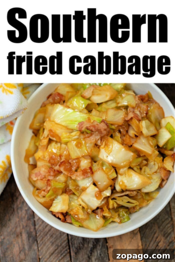 Crispy Air Fryer Cabbage 9 A rustic wooden table holds a bowl of Southern Fried Cabbage, enriched with crispy bacon, showcasing a comforting and hearty meal.