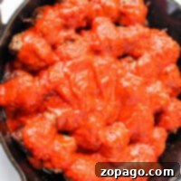 Stovetop Meatball Recipe 8 Learn how to cook meatballs on the stovetop with ease. Enjoy succulent meatballs, perfectly simmered in a bright red tomato sauce, all nestled in a rustic black cast iron skillet.