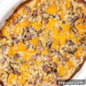 Baked sweet potato casserole topped with pecans and oats, a comforting dish similar to Peach Baked Oatmeal.