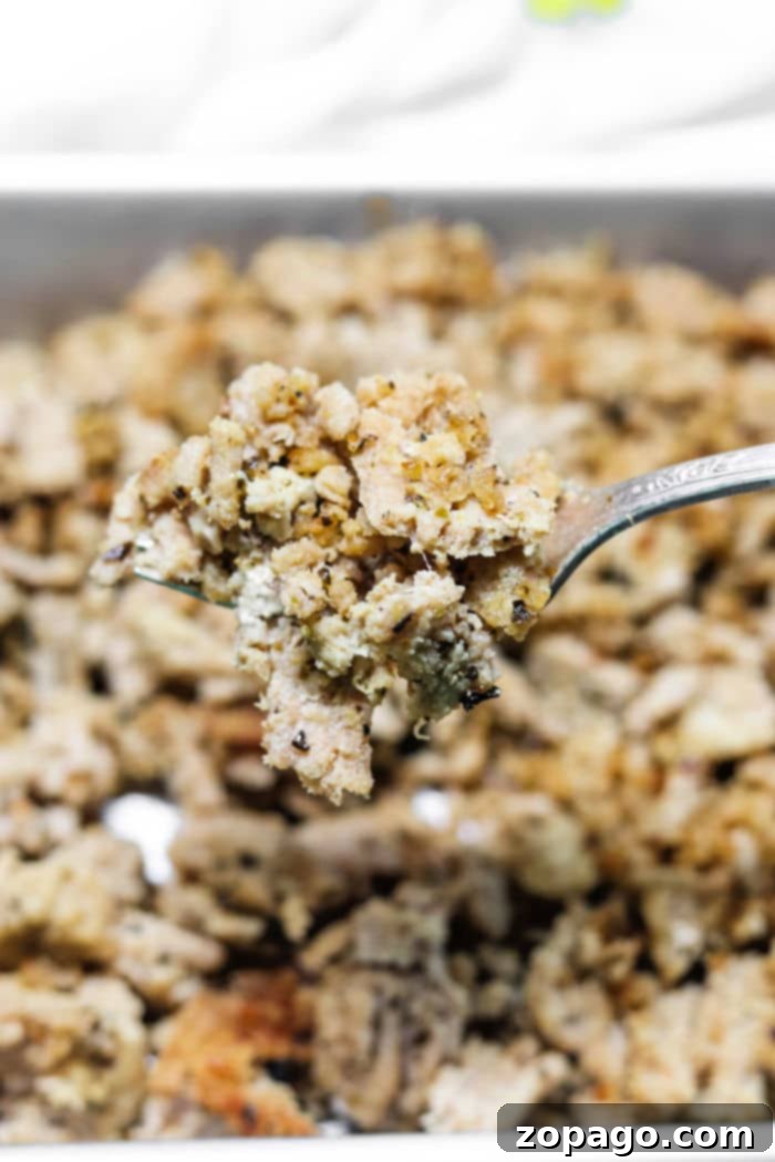 How to Cook Frozen Ground Turkey in an Instant Pot 7 Close-up of a fork lifting a portion of seasoned ground turkey from an Instant Pot, perfectly cooked