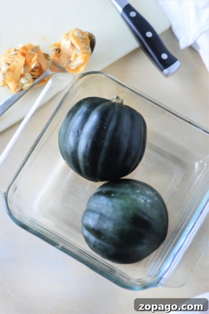 Easy Microwave Acorn Squash 4 Two halves of microwave acorn squash, beautifully cooked and ready to be seasoned, showcasing a perfect quick meal solution.