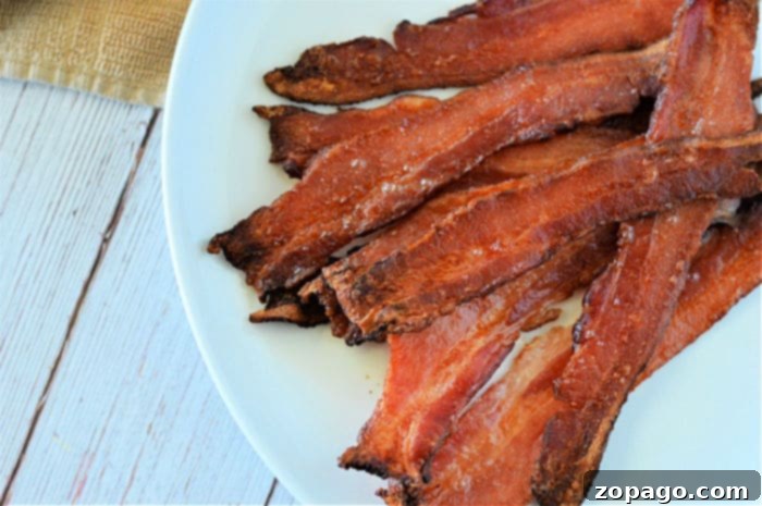 5-Minute Microwave Meals 5 Crispy microwave-cooked bacon on a plate with paper towels.