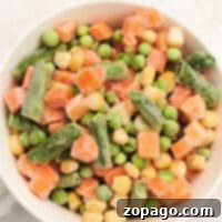 Discover how to cook frozen vegetables with this enticing mix of peas, carrots, corn, and green beans—all perfectly combined in one bowl.