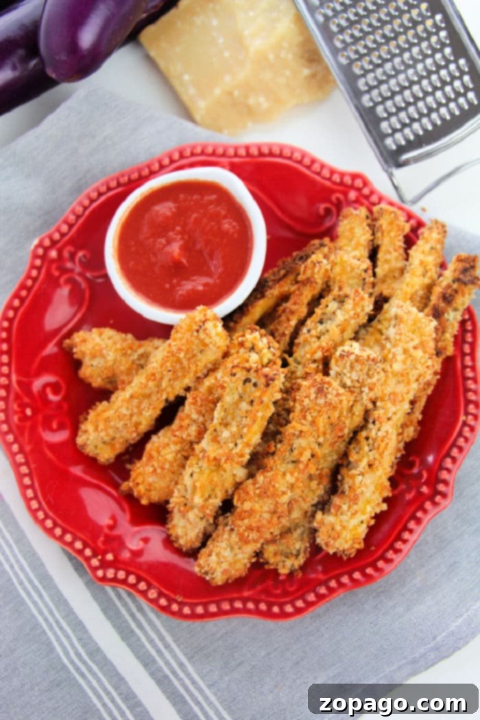 A generous serving of freshly made eggplant French fries, ready for dipping and enjoying.