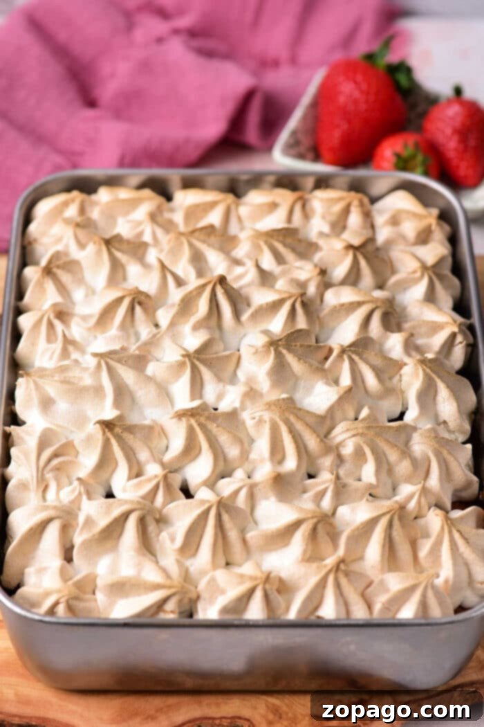 Zesty Lemon Meringue Strawberry Shortcake 7 A stunning Lemon Meringue Strawberry Shortcake, beautifully plated with fresh berries and delicate meringue peaks.